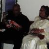Deacon Johnson opening his gifts. — with Deaconess Johnson